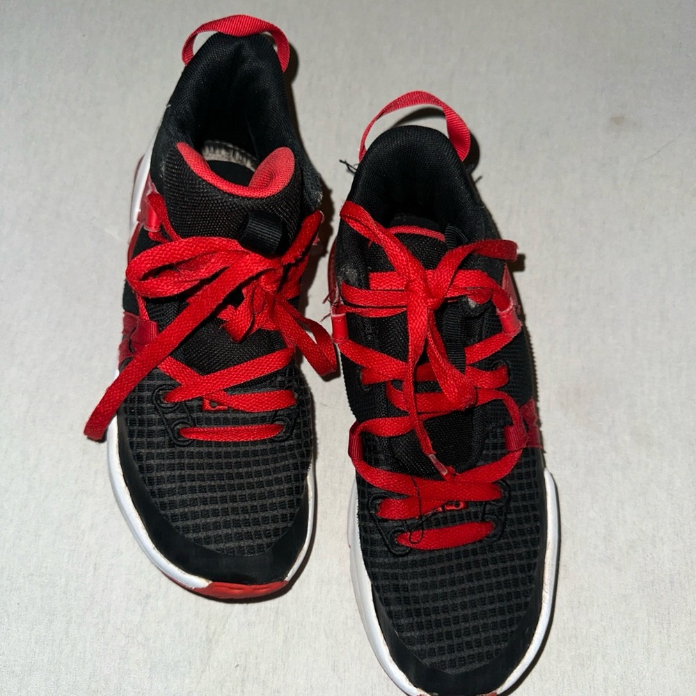 Kids Size 4.5 Nike Black and Red Sneakers.